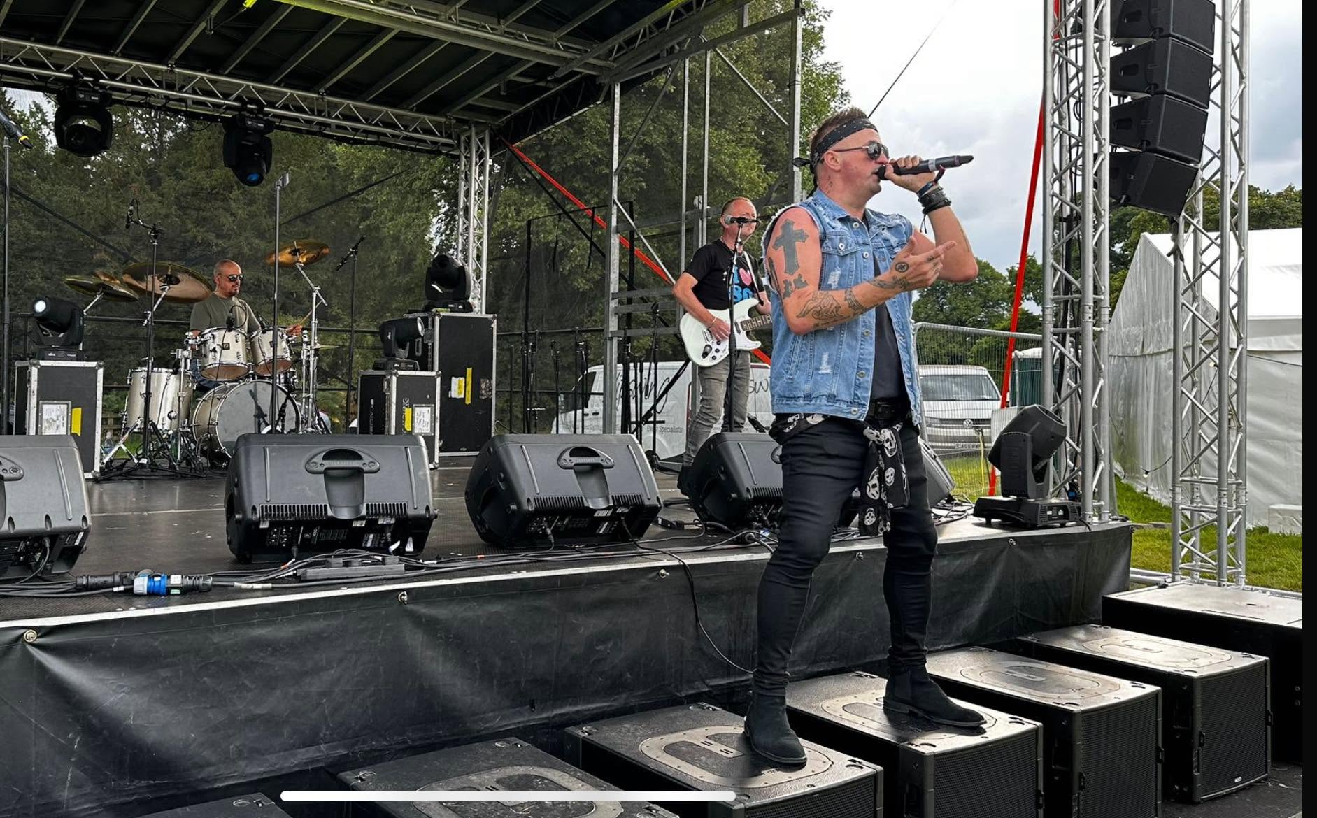 The Rubix Effect performing an outdoor festival set live on stage at APAD Fest 2025
