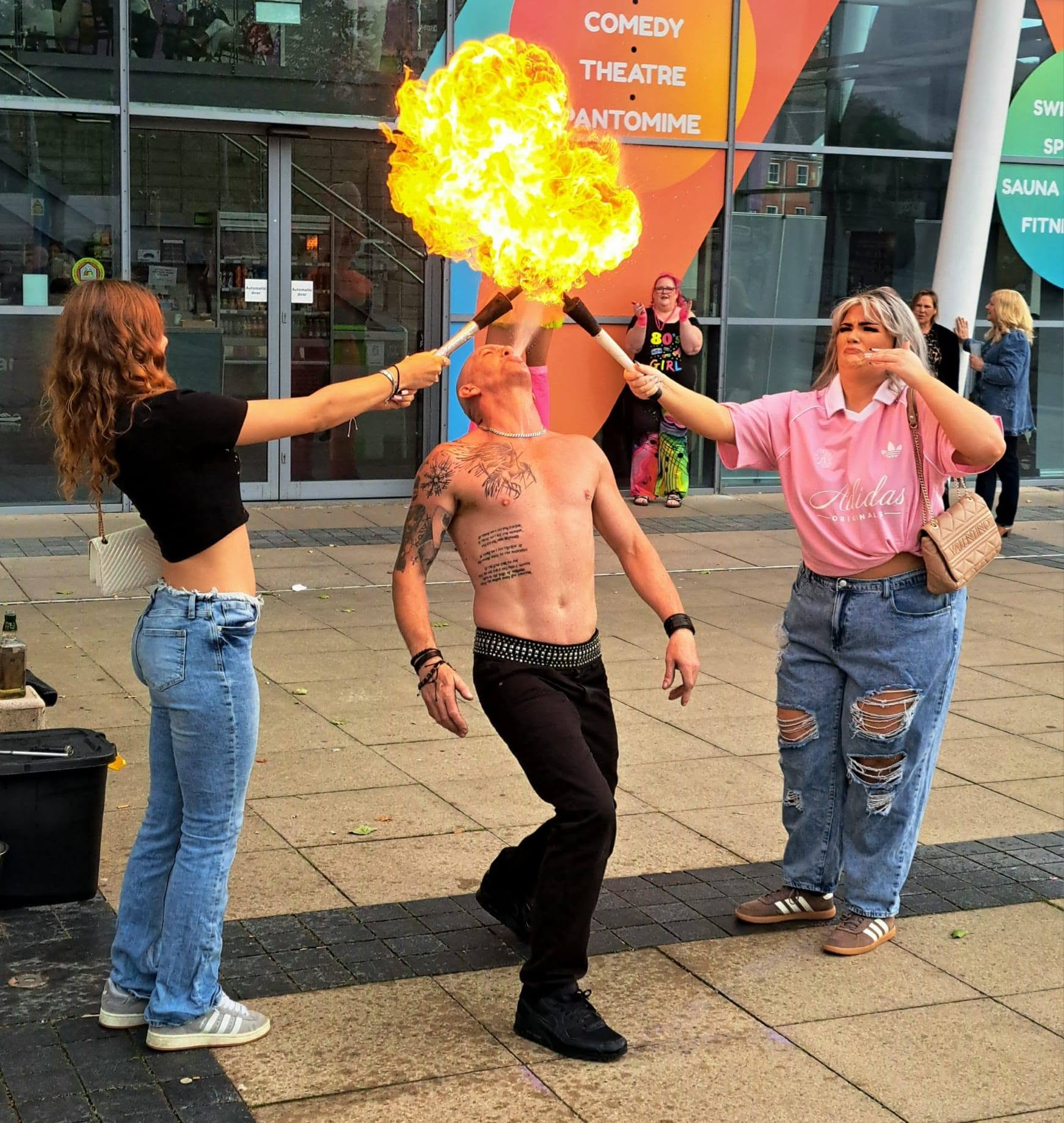 Professional fire breather executing a performance stunt for the audience